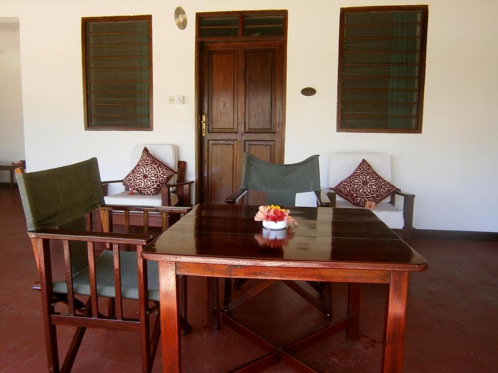 Flame Tree Cottages Nungwi Quarto foto
